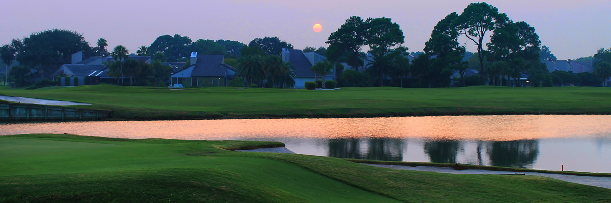 Picture of a golf course during sunset